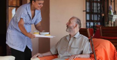 What is the difference between a care home and home care?