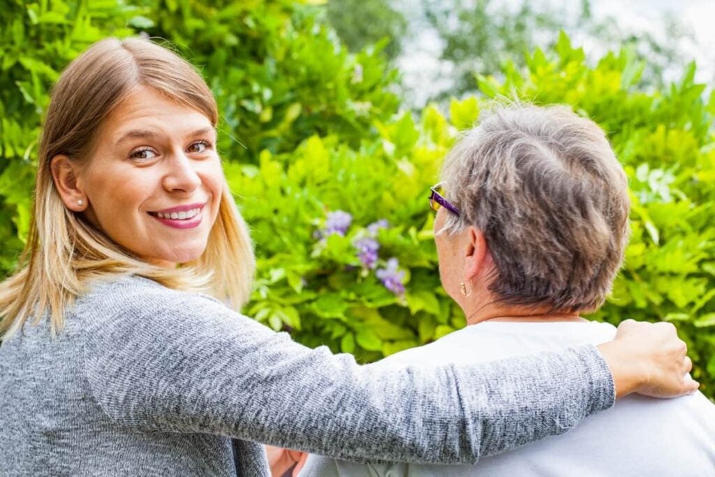 Smiling aged carer